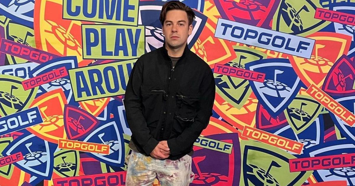 Cody Ko in front of a Top Golf wall