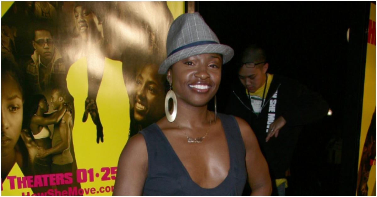 Choreographer Tanisha Scott posing at a movie premiere. 