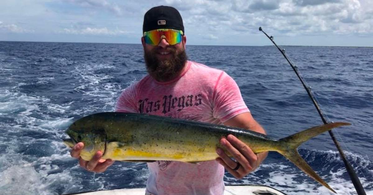 Cody Sargent holding a fish he caught.