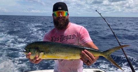 Cody Sargent holding a fish he caught.