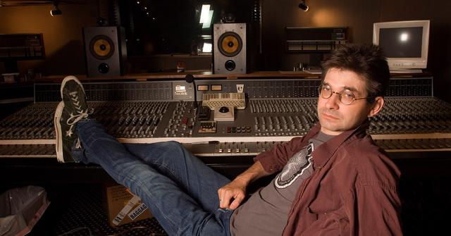 Steve Albini sitting in front of a mixer at his studio.