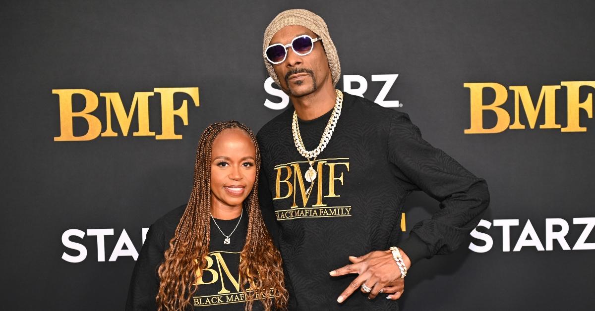 Snoop Dogg and Shante Broadus attending a red carpet event together.