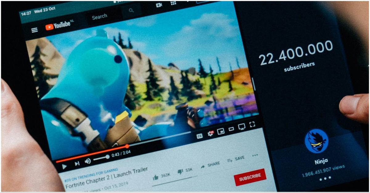 A guy browsing YouTube on his tablet