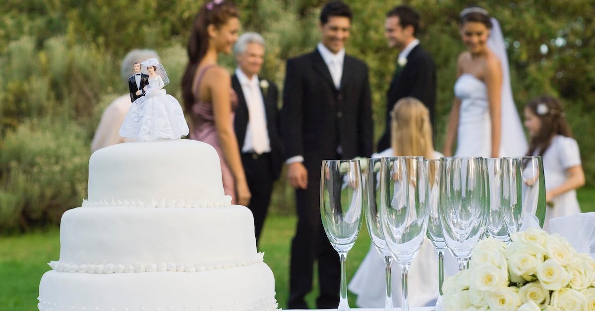 A wedding party with a cake and glasses on the table