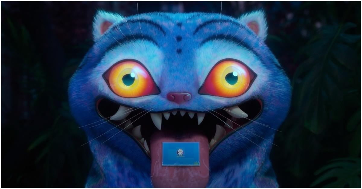 Derpy the tiger with a invitation in his mouth