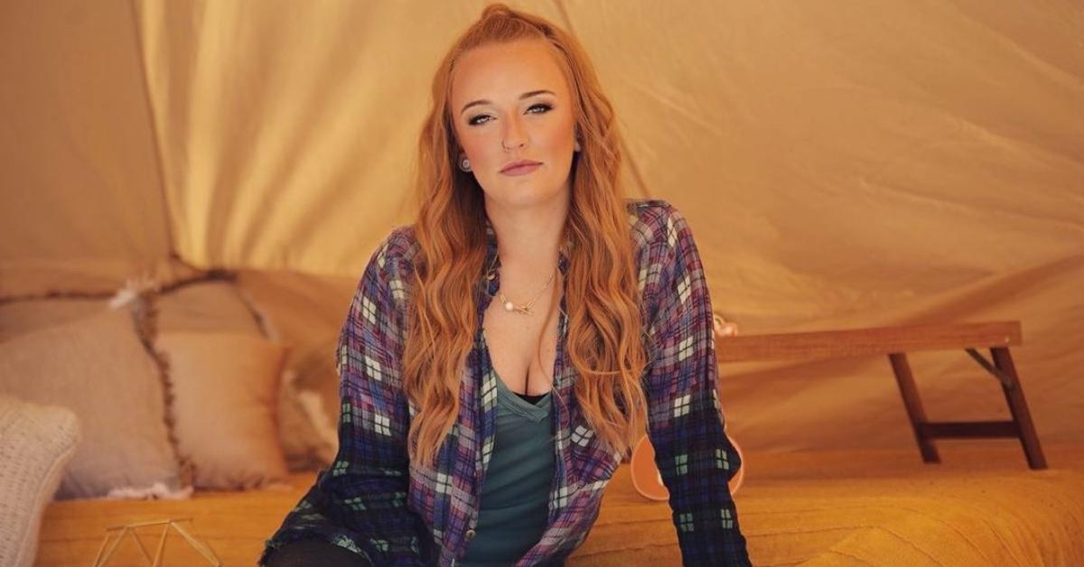 Maci Bookout in a flannel in a tent