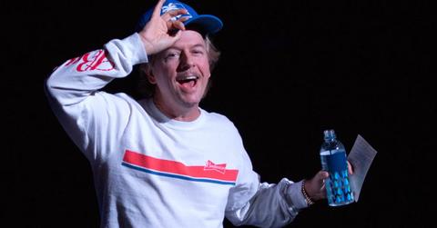 David Spade on stage at a comedy show