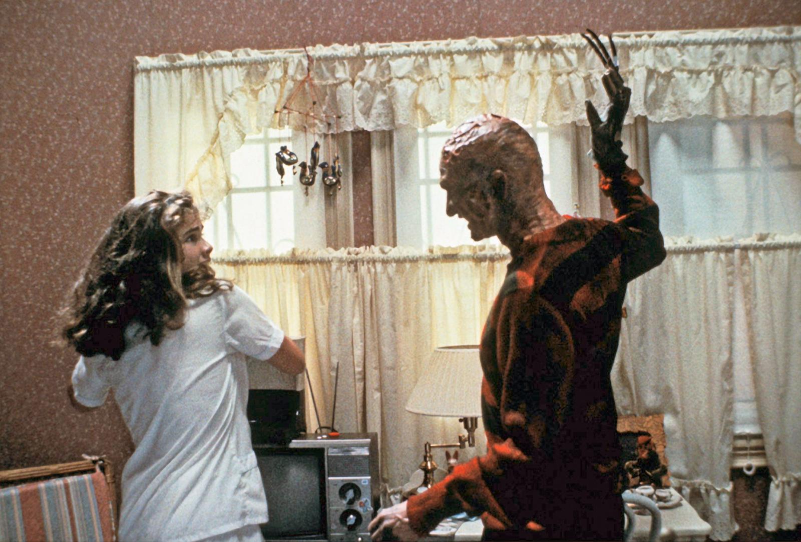 Heather Langenkamp as Nancy and Robert Englund as Freddy Krueger