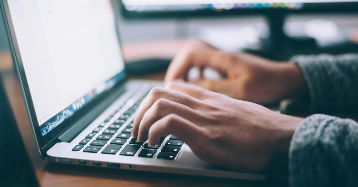 person typing on computer