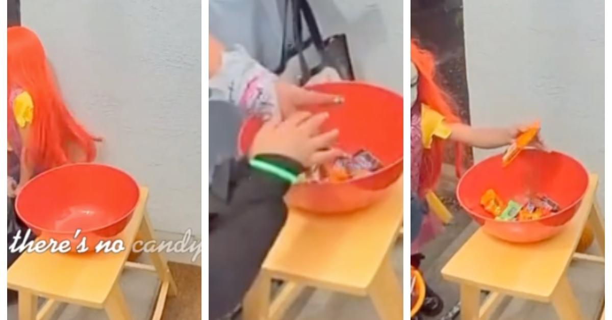 kids put their own candy in empty bowl on halloween while trick-or-treating