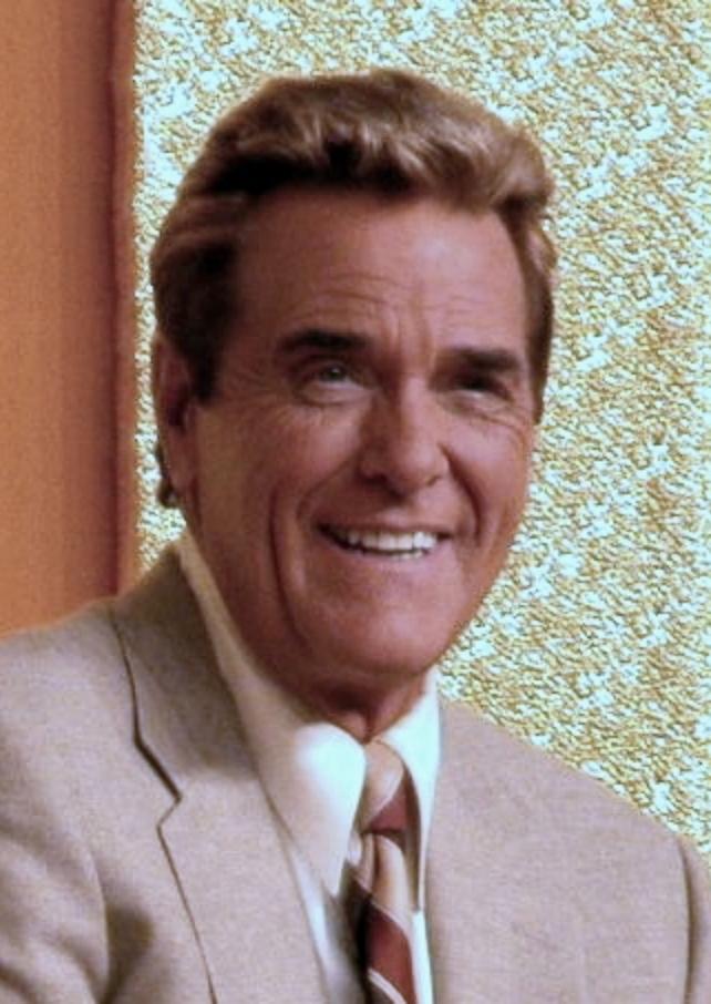 Chuck Woolery hosting a show.