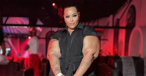 Brandi Mallory in a black jumpsuit.