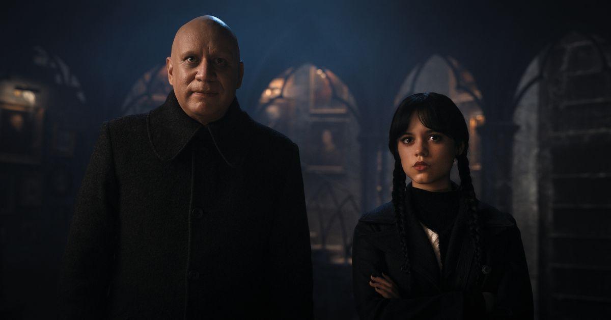 (l-r): Fred Armisen as Uncle Fester and Jenna Ortega as Wednesday.