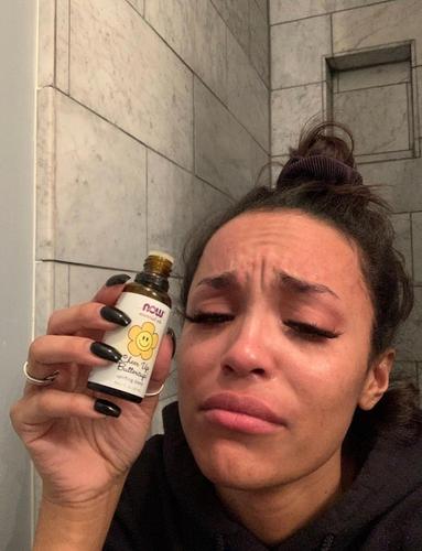 serene Russell holding essential oils