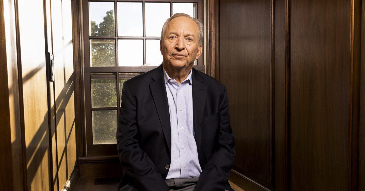 Larry Summers sitting by a window.