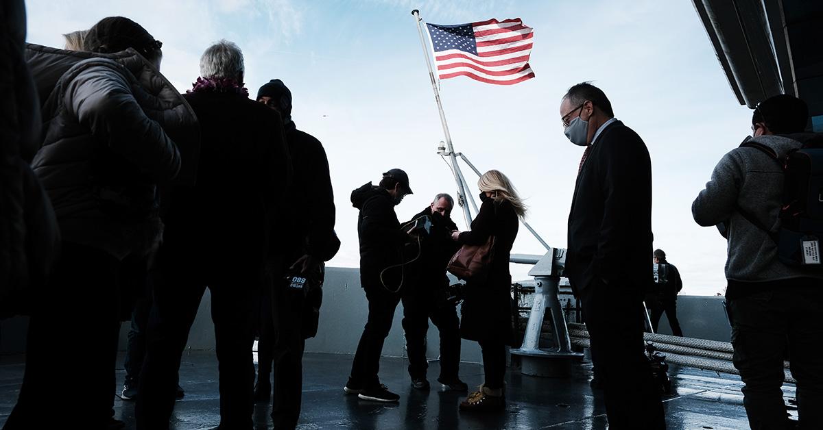 A flag being raised at a ceremony commemorating Pearl Harbor.