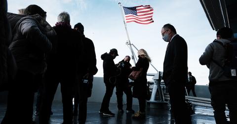 A flag being raised at a ceremony commemorating Pearl Harbor.