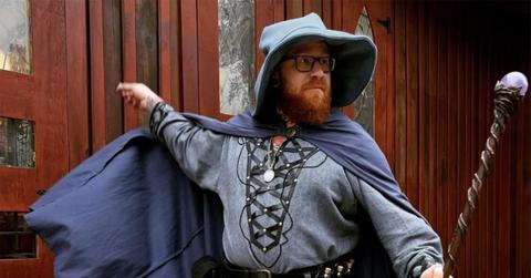 Baddie in a wizard's outfit with a cloak and a staff.