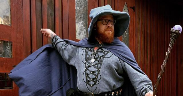 Baddie in a wizard's outfit with a cloak and a staff.