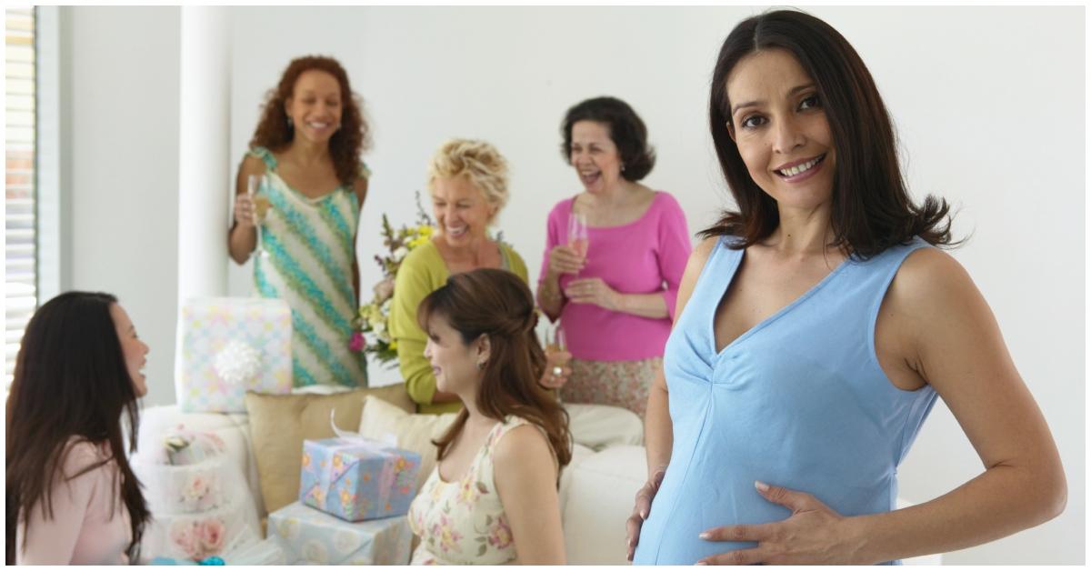 (l-r): A group of friends and a pregnant woman at a party