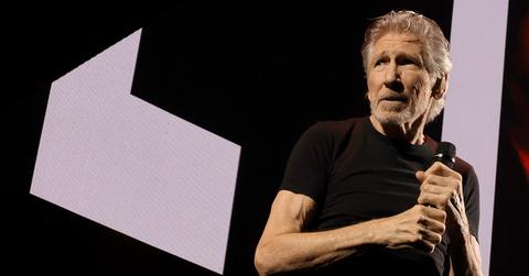 Roger Waters holding a mic onstage,