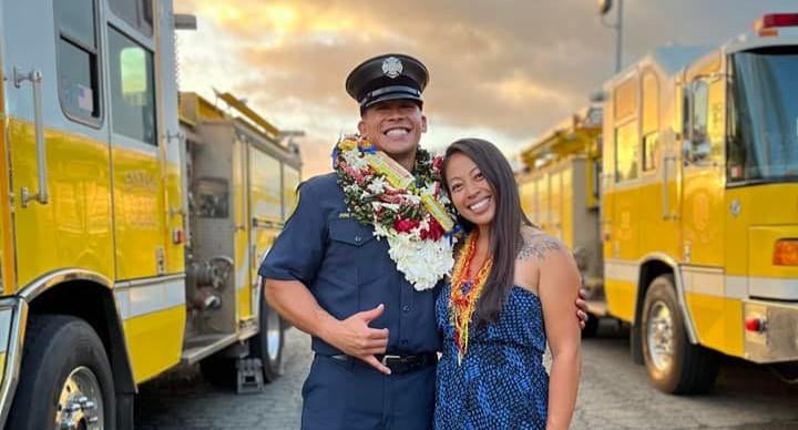 Bradford Davis and his wife Melanie in his firefighter uniform