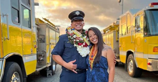 Bradford Davis and his wife Melanie in his firefighter uniform