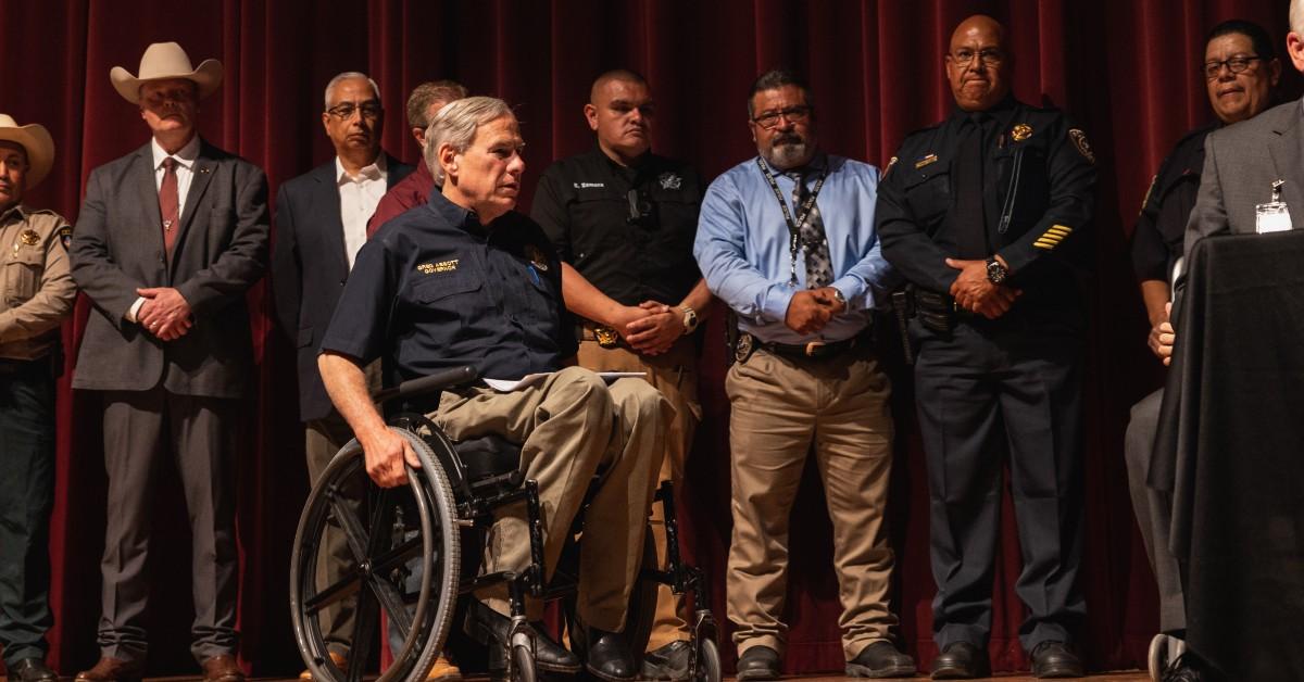 Greg Abbott on stage on his wheelchair. 