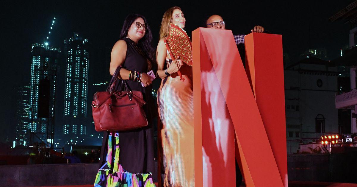 Fans posing with the Netflix logo in Mumbai. 