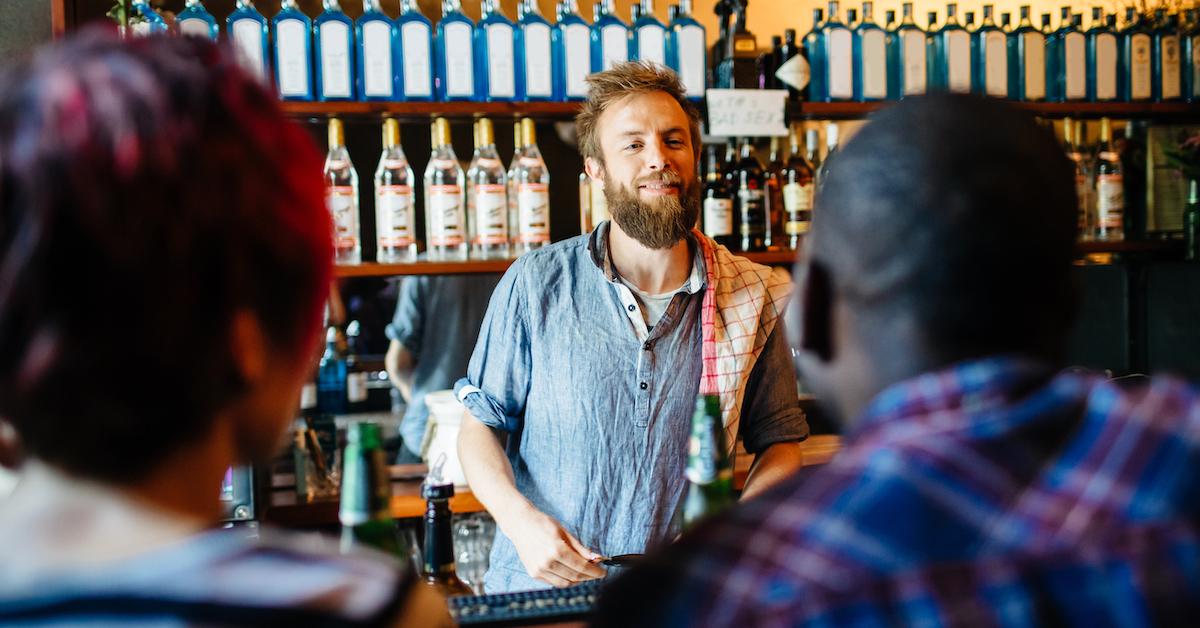 men offering women drinks