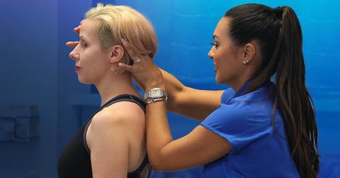 Dr. Colón adjusting a patient's neck