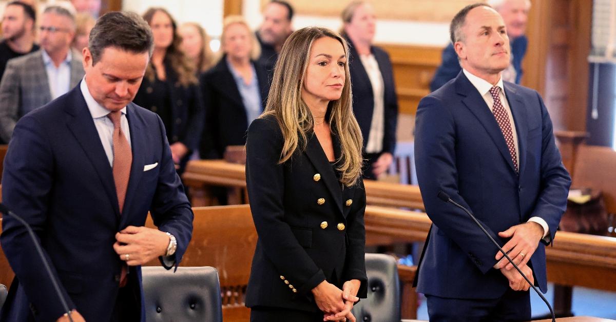 Defense attorneys Alan Jackson and David Yannetti stand with their client Karen Read at Norfolk County Superior Court