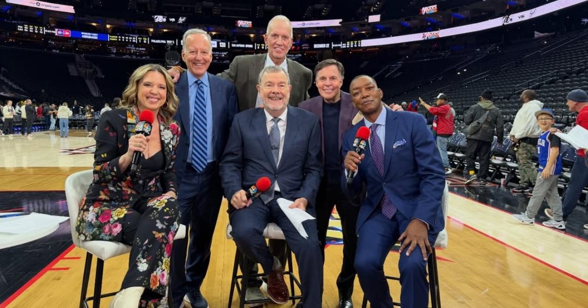 Isiah Thomas on the court with other NBA sports reporters.