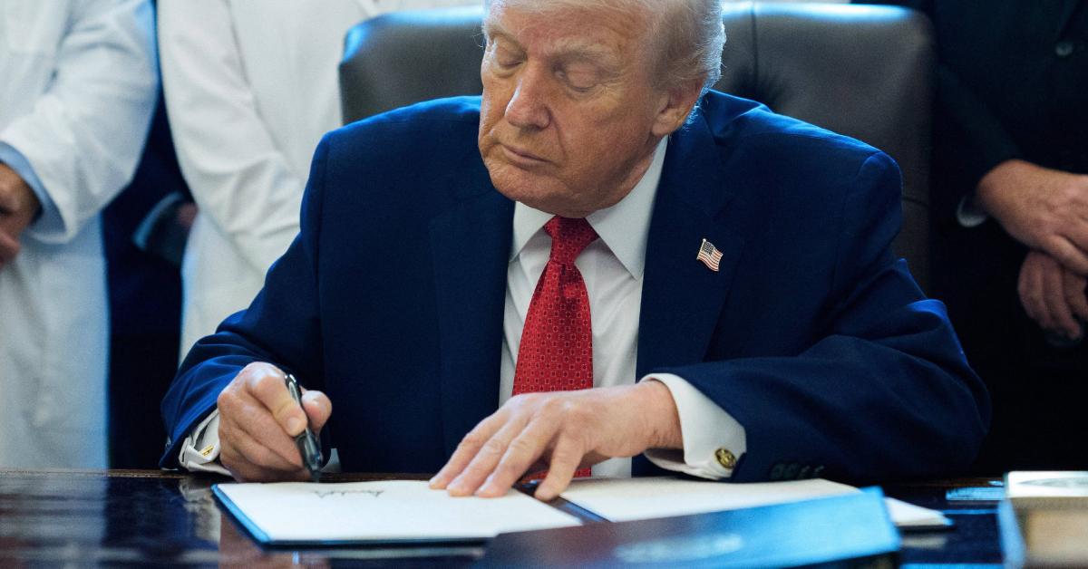 Donald Trump signing an executive order.