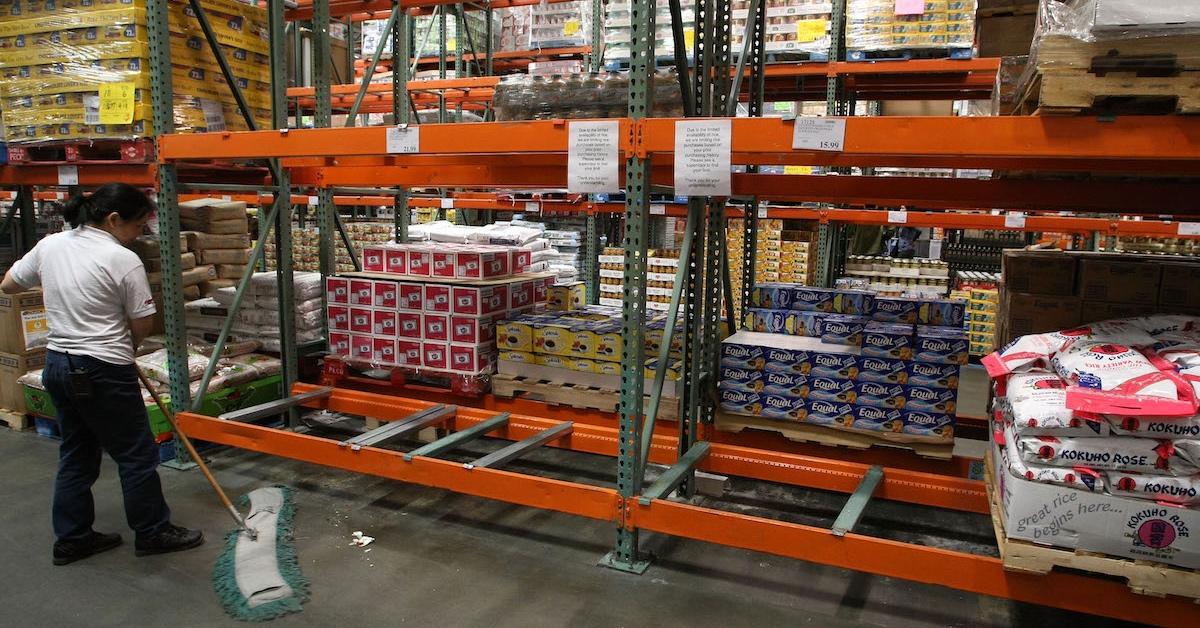 An employee using a broom at Costco