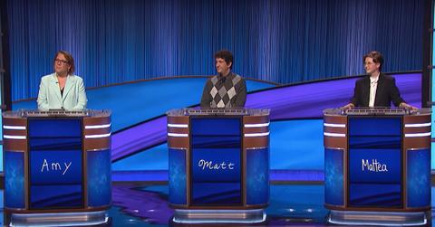 Mattea Roach (r) on the 'Jeopardy!' stage with contestants Amy and Matt in 2022