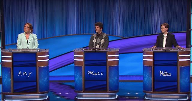 Mattea Roach (r) on the 'Jeopardy!' stage with contestants Amy and Matt in 2022