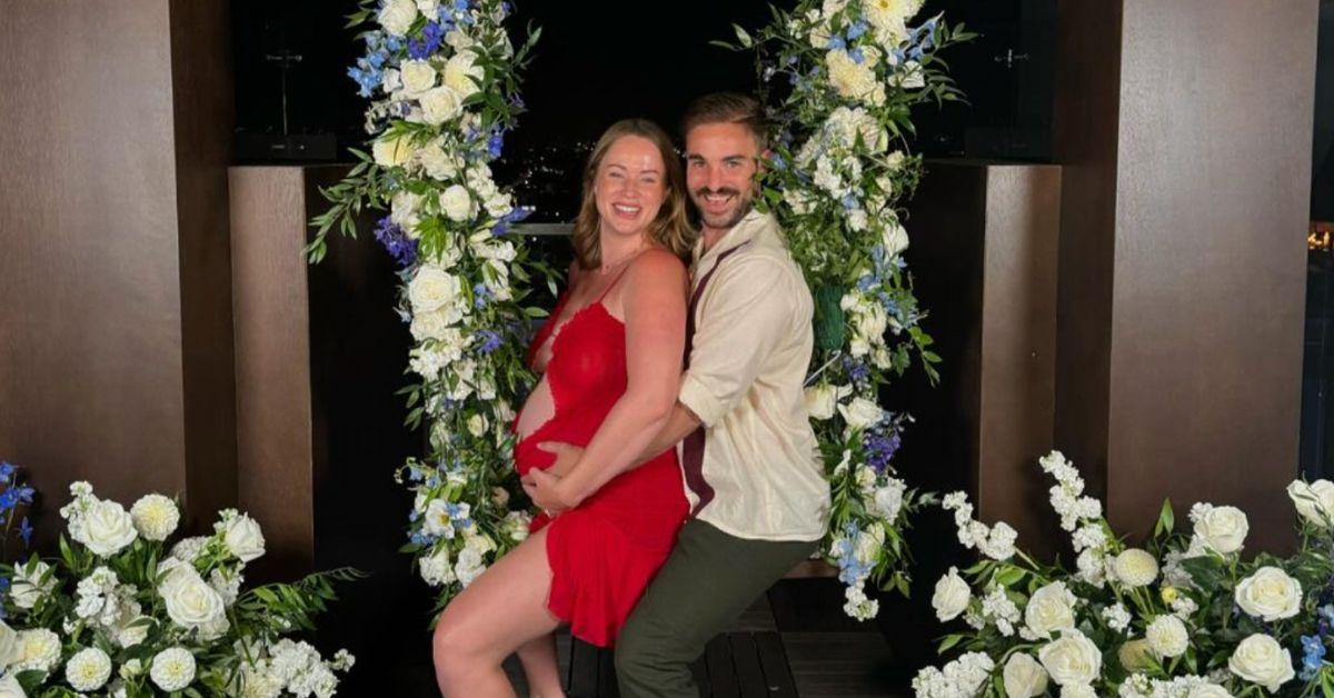 Whitney and her husband Connor pose for a photo together on a swing at the 'Secret Lives of Mormon Wives' premiere party