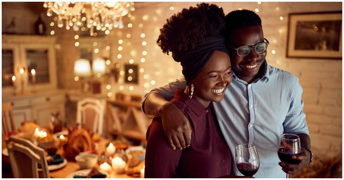 Two Black people drinking wine