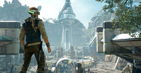 'Jedi: Survivor' Cal and BD-1 in front of a towering abandoned building.