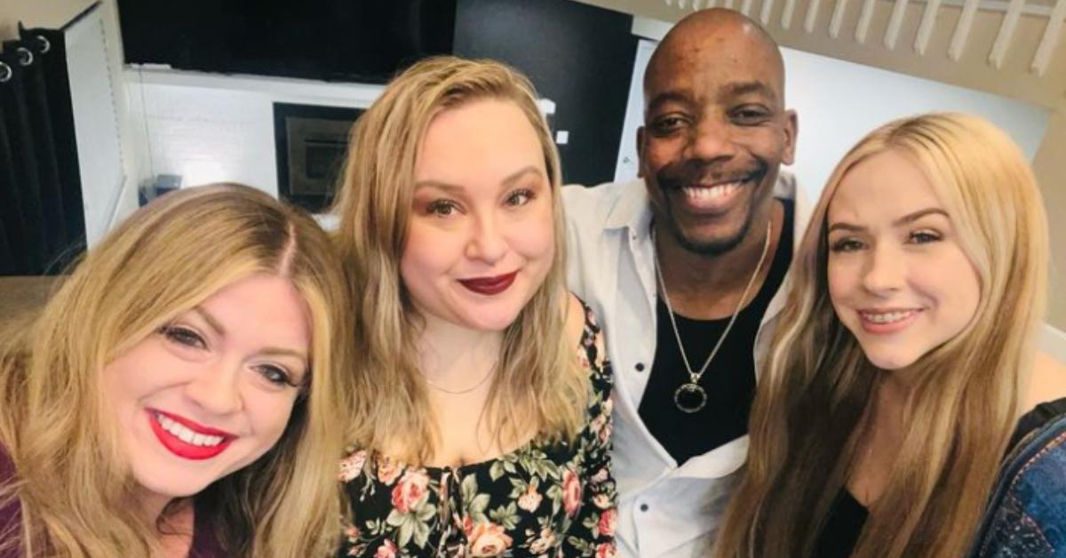 (L-R) April, Danielle, Nick, and Jennifer smiling and posing for a photo together.