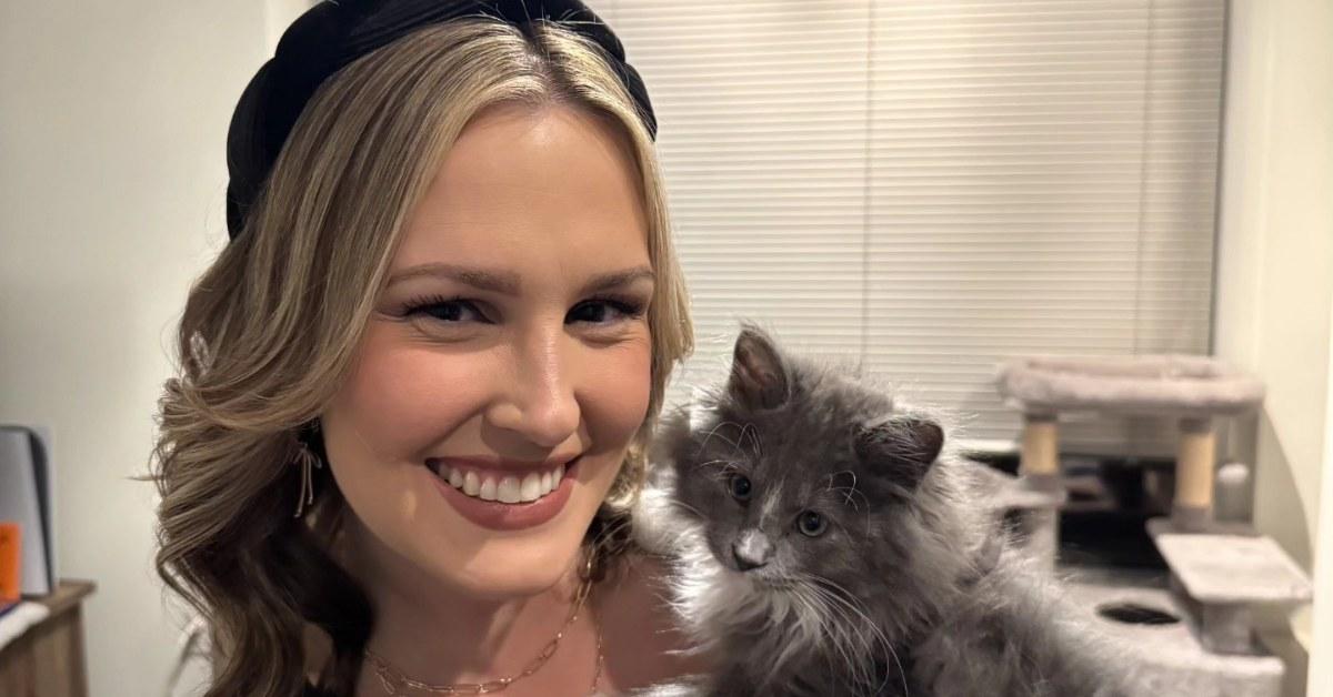 Lindsey Slater holding her fluffy cat.