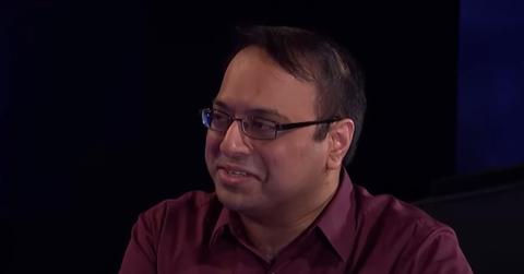 Yogesh Raut wears glasses and a red collared shirt