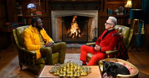 Deontay and Alan sit by a fire in the castle on The Traitors