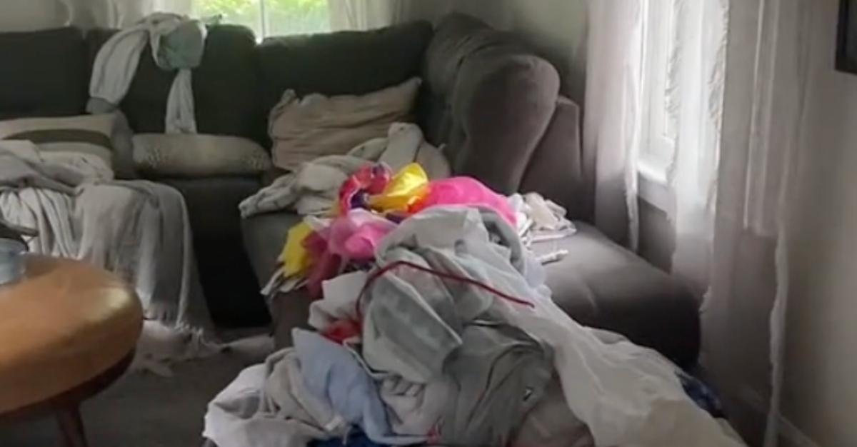 A wife shows her messy house after she actually "did nothing" for two days.