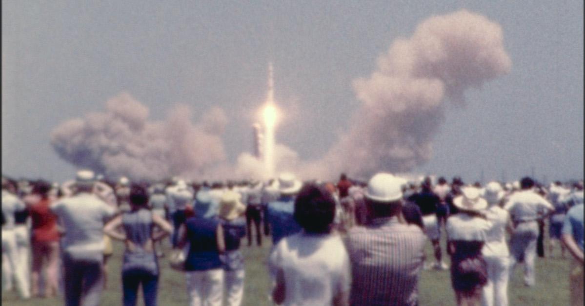 Apollo 13 blasts off in front of crowd