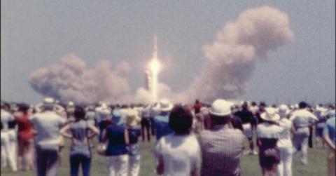 Apollo 13 blasts off in front of crowd