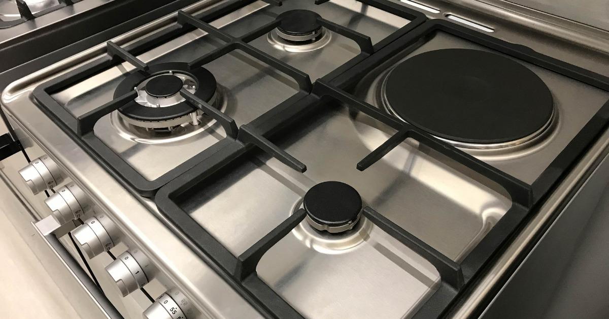 angle view of gas modern stove and electric oven picture id