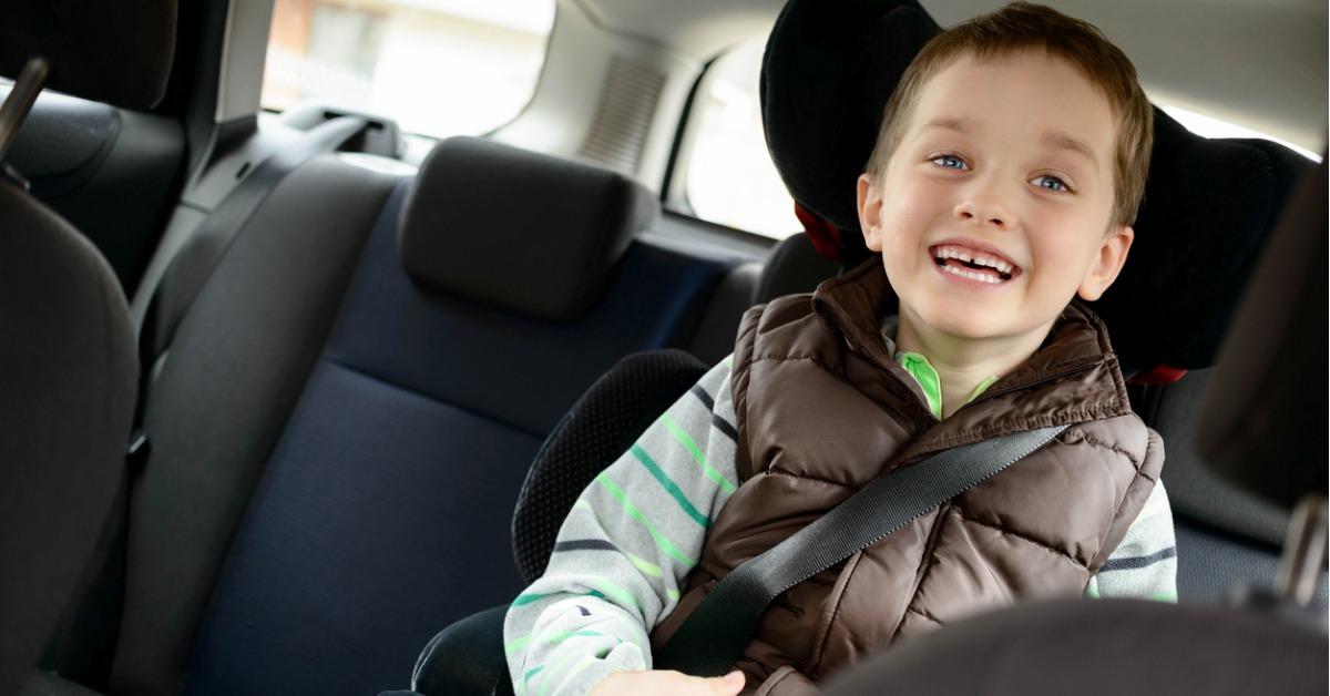 happy little boy in car safety seat picture id