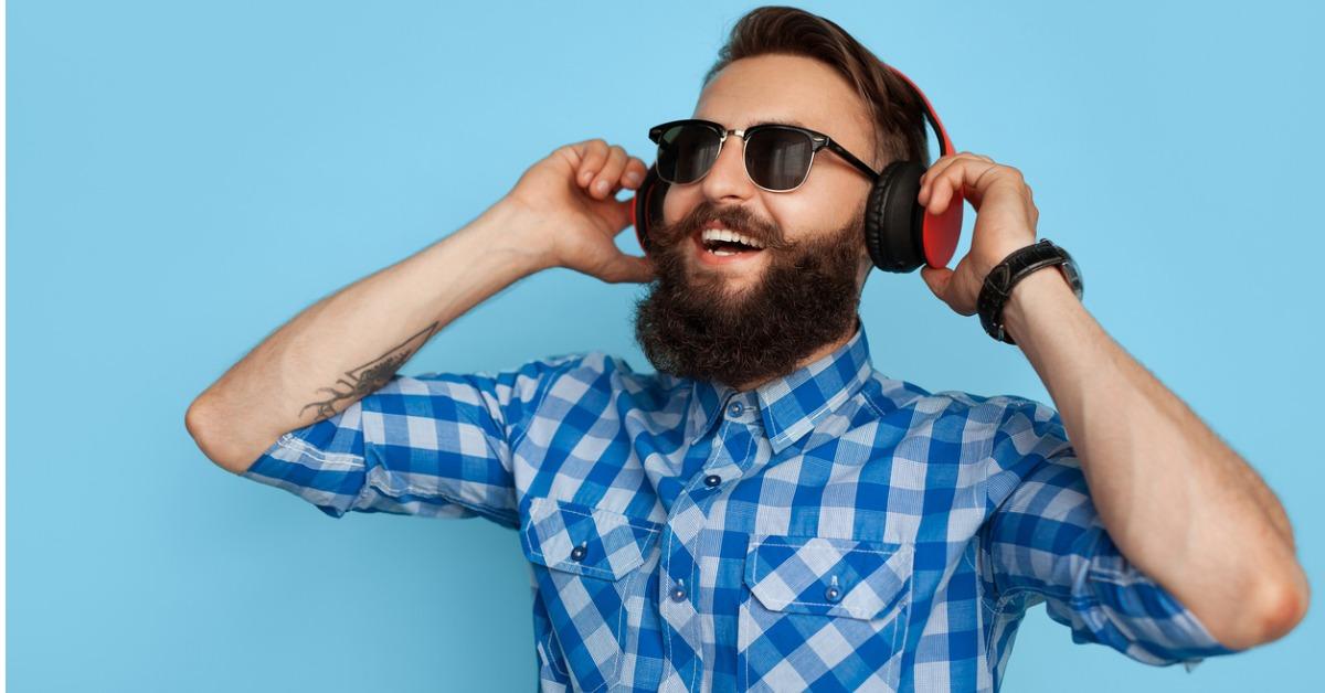 content hipster in headphones picture id